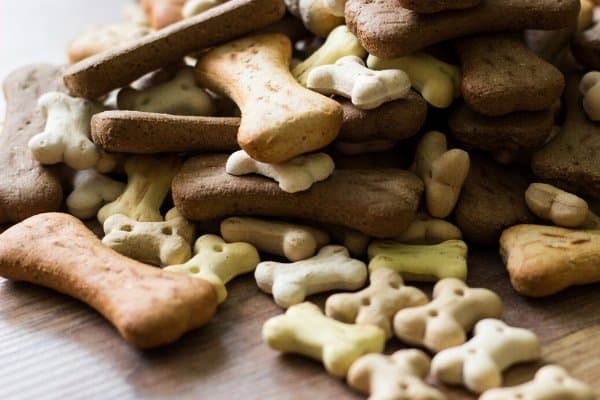 A variety of different sized dog bones in a pile.