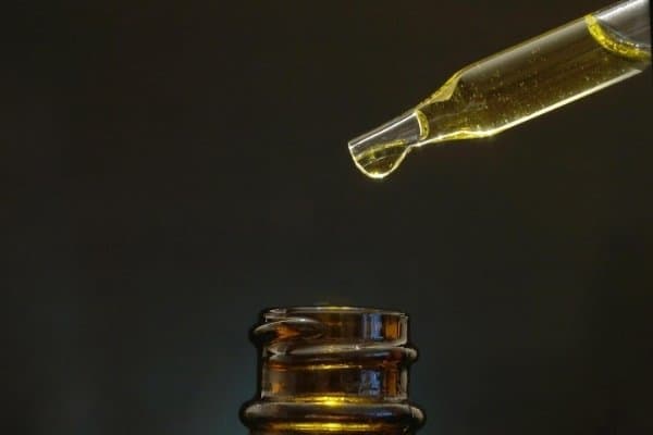 Amber bottle and dropper of CBD oil.