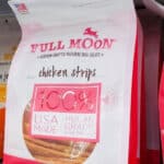 Full Moon Dog Treats on store shelf.