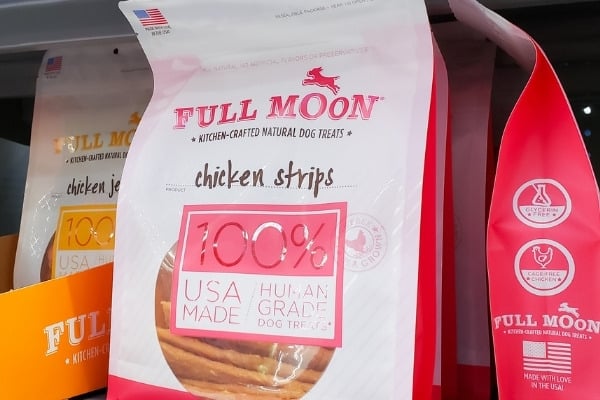 Full Moon Dog Treats on store shelf.